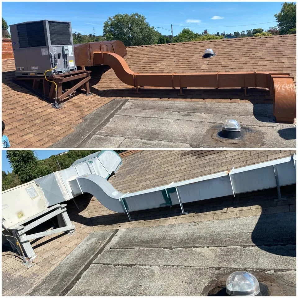 Rooftop HVAC installation with metal ductwork, air handling unit, and roof vents on asphalt shingle roof