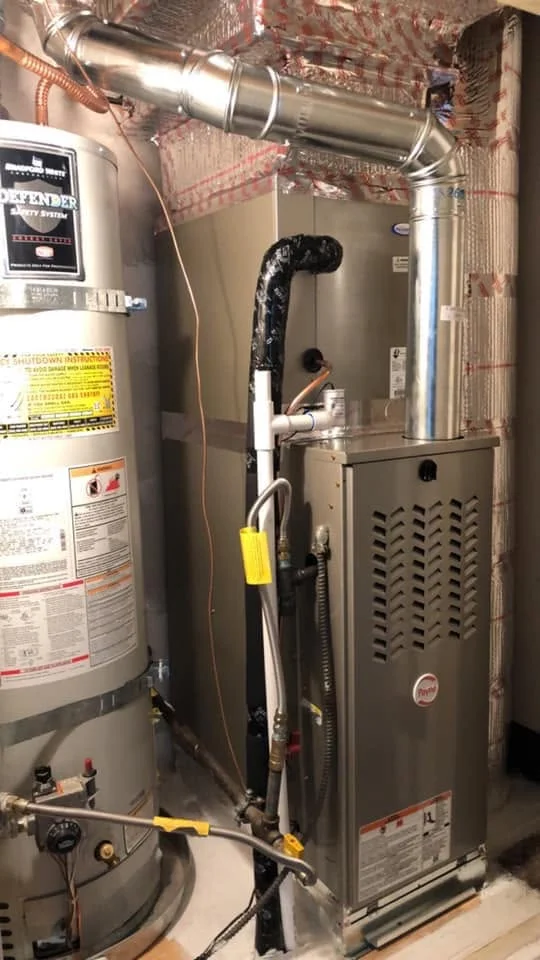 Gas furnace and water heater installation with metal ductwork and sealed connections