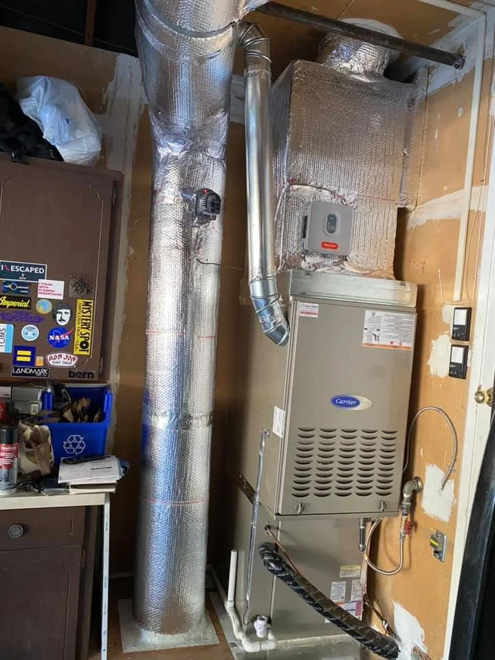 Carrier furnace with insulated flex ductwork and reflective wrap installation